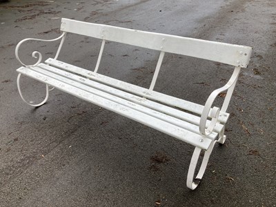Lot 1153 - A white painted wrought iron and slatted wood...