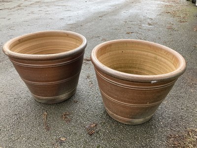 Lot 1239 - A pair of earthenware circular garden planters,...