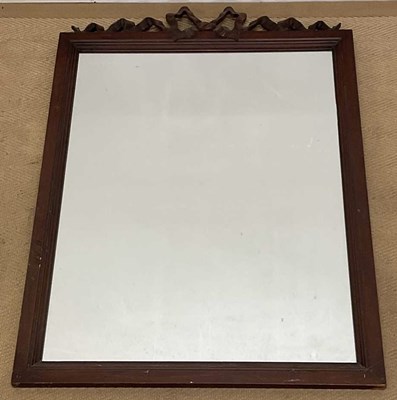 Lot 573 - An oak rectangular wall mirror, with ribbon...
