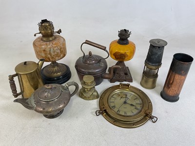 Lot 21 - A group of Victorian and Edwardian oil lamps...