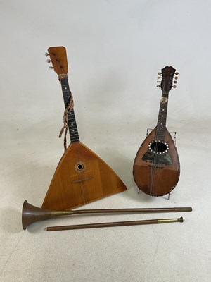 Lot 47 - A Russian balalaika, a copper and brass...