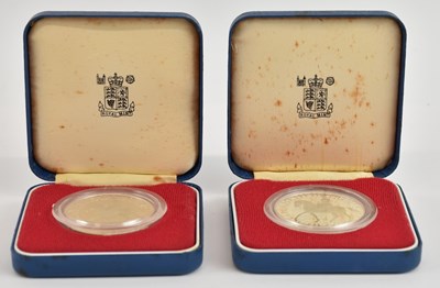 Lot 1491 - THE ROYAL MINT; two cased encapsulated Queen...