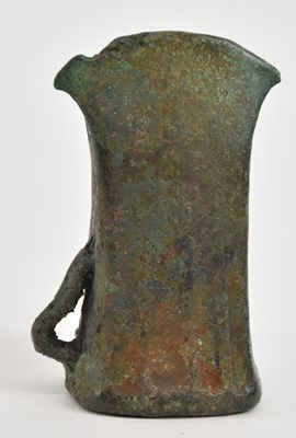 Lot 298 - An ancient patinated bronze axe head, 7 x 4cm.