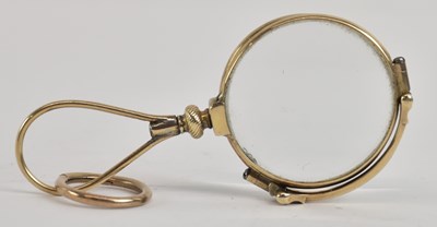 Lot 1206 - A pair of yellow metal folding lorgnettes,...