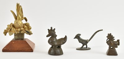 Lot 334 - A set of three Burmese bronze opium weights,...