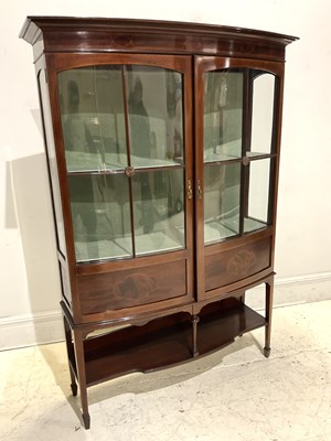Lot 1022 - An Edwardian mahogany bowfront display cabinet,...
