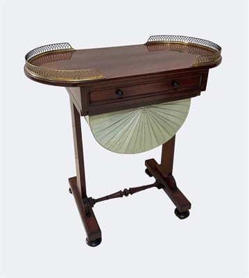 Lot 1008 - An early 19th century rosewood oval work table,...