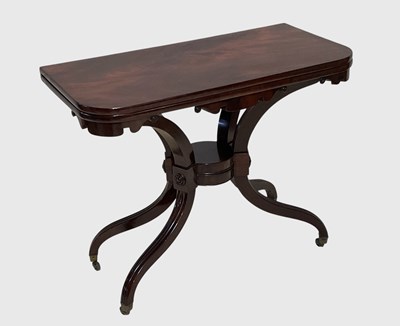 Lot 1018 - A William IV mahogany fold-over tea table, on...