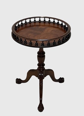 Lot 1028 - A reproduction mahogany circular occasional...