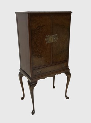 Lot 1035 - A reproduction walnut cabinet in the Queen...