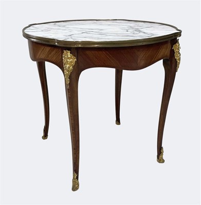 Lot 1031 - A French Louis XV style walnut circular...