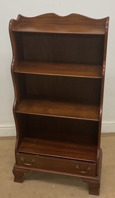 Lot 513 - A mahogany reproduction waterfall bookcase,...
