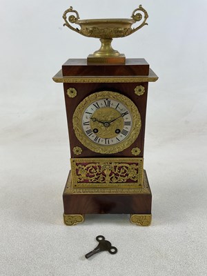 Lot 426 - A French mahogany Empire style mantel clock...