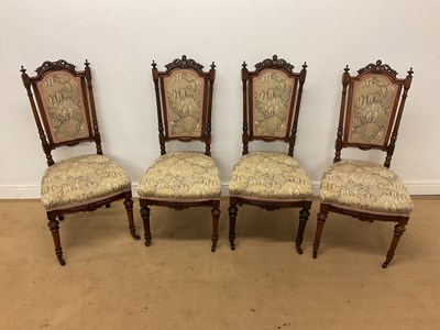 Lot 543 - A set of four late Victorian carved walnut...