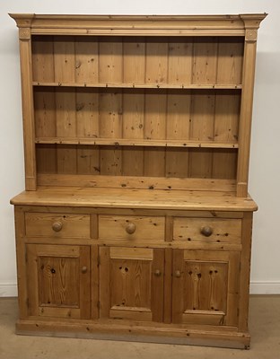 Lot 460 - A pine dresser, the top having a panelled back,...