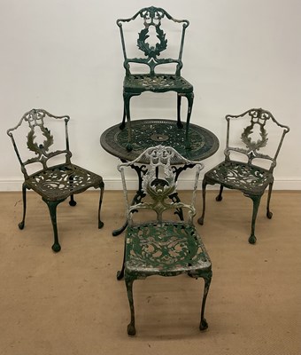 Lot 444 - A cast aluminium garden table and four chairs...