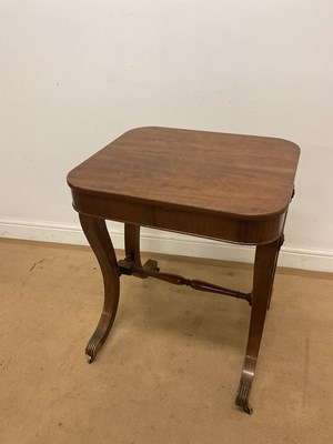 Lot 529 - A mahogany occasional table raised on brass...