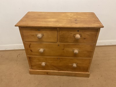 Lot 505 - A pine chest of drawers two small over two...