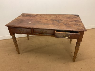 Lot 555 - A 19th century pine three drawer kitchen table...