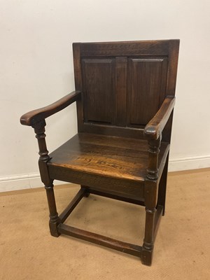Lot 528 - An early 19th century oak hall chair with...