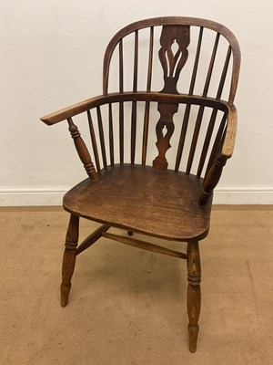 Lot 553 - A 19th century elm and ash low back Windsor...