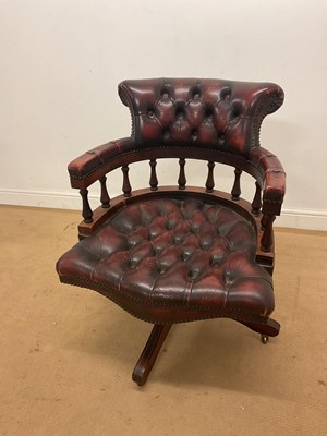 Lot 506 - A mahogany and leather button backed captain's...