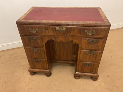 Lot 509 - A walnut knee hole lady's writing desk with...