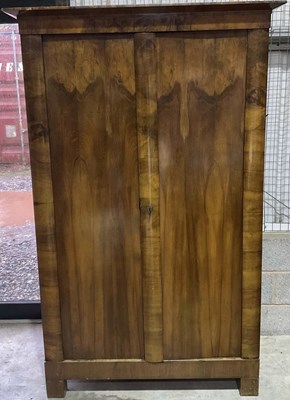 Lot 495 - A walnut bedroom wardrobe, with key, height...