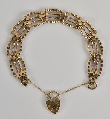 Lot 1413 - A 9ct yellow gold gate link bracelet, with...