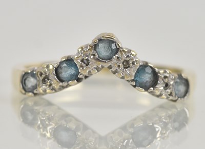 Lot 1263 - A 9ct yellow gold blue topaz and diamond set...