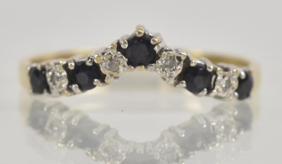 Lot 1264 - A 9ct yellow gold diamond and sapphire set...