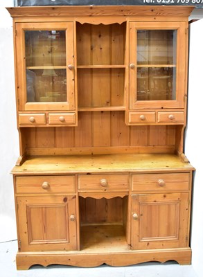 Lot 14 - A Victorian-style pine dresser, the top with a...