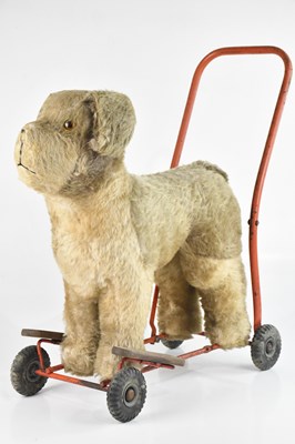 Lot 691 - LINES BROS; a vintage push along dog walker,...