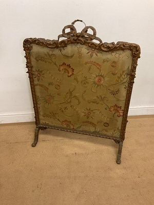 Lot 472 - A 19th century tapestry fire screen with gilt...