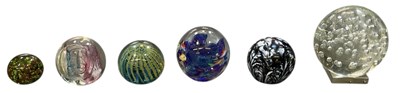 Lot 600 - Six assorted art glass paperweights, including...