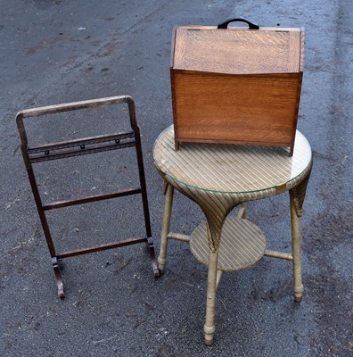Lot 1705 - An oak magazine rack