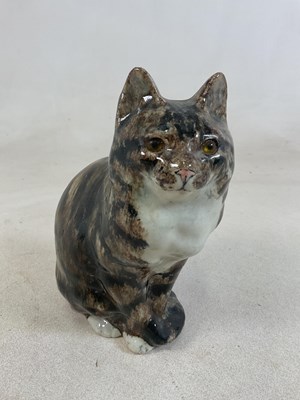 Lot 182 - WINSTANLEY POTTERY; a model of a tabby cat in...
