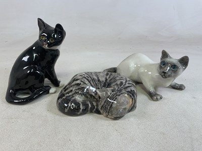 Lot 192 - WINSTANLEY POTTERY; three models of cats, one...
