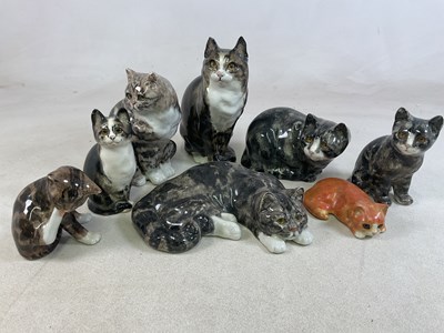 Lot 194 - WINSTANLEY POTTERY; eight cat models in...