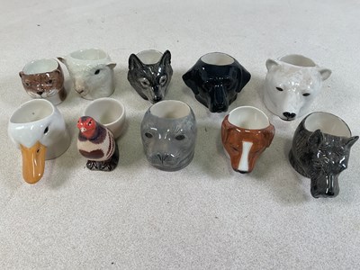 Lot 198 - QUAIL POTTERY; animal head egg cups to include...