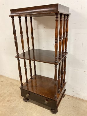 Lot 710 - An early 20th century three tier whatnot with...