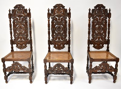 Lot 21 - A set of six Jacobean-style carved oak dining...