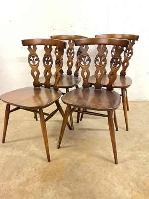 Lot 726 - A set of four Ercol mid century fleur de lis...