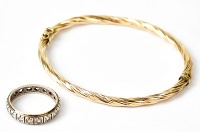 Lot 739 - A 9ct yellow gold twist bangle, approx. 4.7g,...