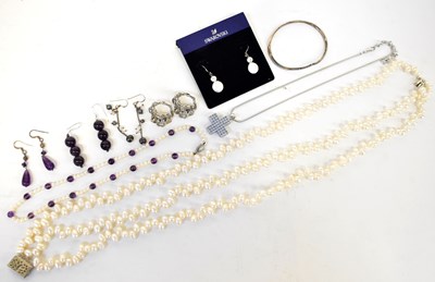Lot 732 - A 925 silver Pandora bangle set with white...