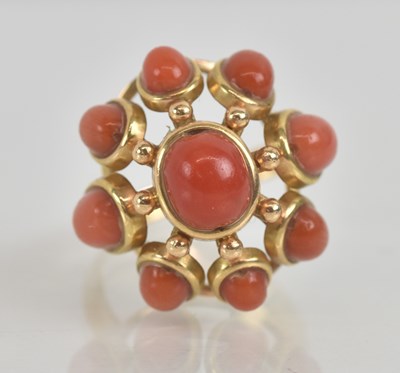 Lot 1217 - A yellow metal coral set cluster ring, set...