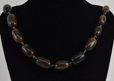 Lot 1008 - An early 20th century single strand rhinoceros...