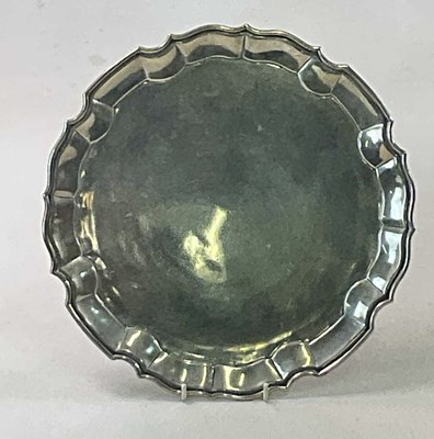 Lot 344 - A sterling silver salver with shaped rim,...