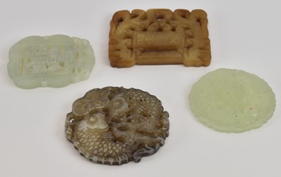 Lot 1042 - A Chinese carved pierced green jade pendant, 5...