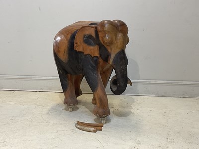 Lot 1230 - A large wooden elephant, height 103cm.